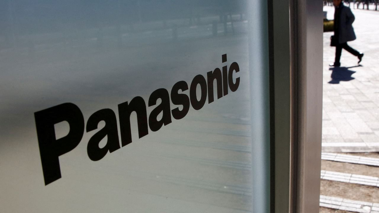 A man is seen next to a Panasonic logo at Panasonic Center in Tokyo. Credit: Reuters Photo