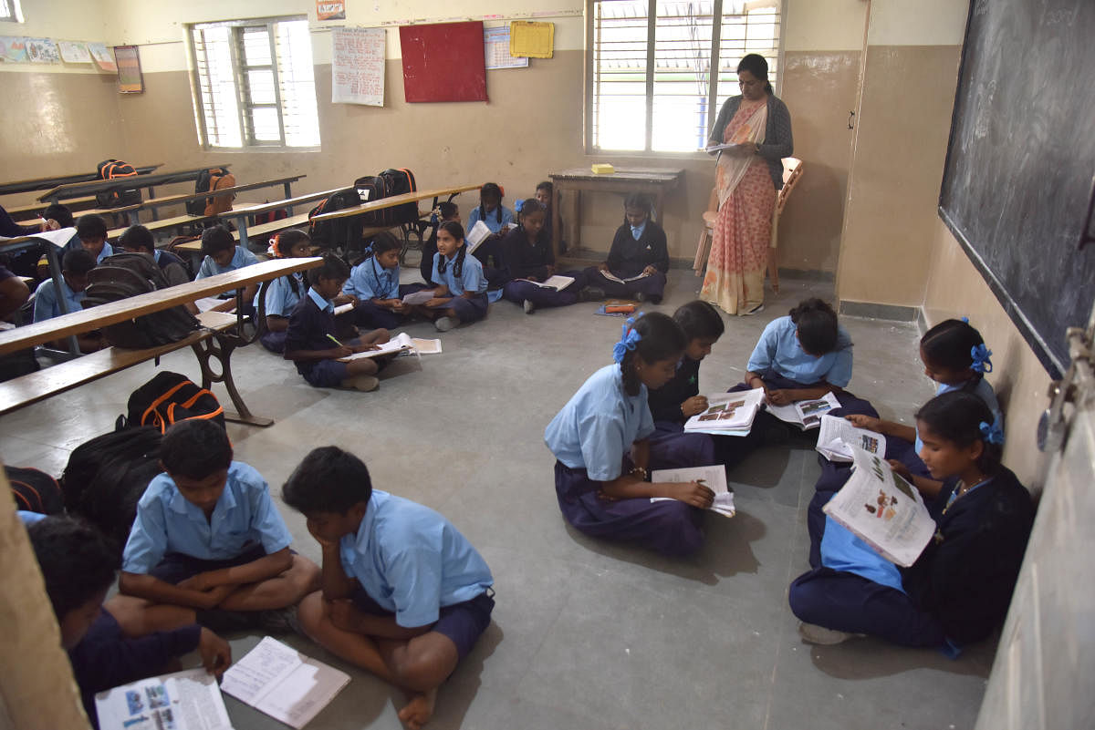 The strength of classroom 40, attending students very less at the Seventh standard class room at Government School Hunasamaranahalli, due to the scare of Kovid 19, in Bengaluru. Credit: DH Photo