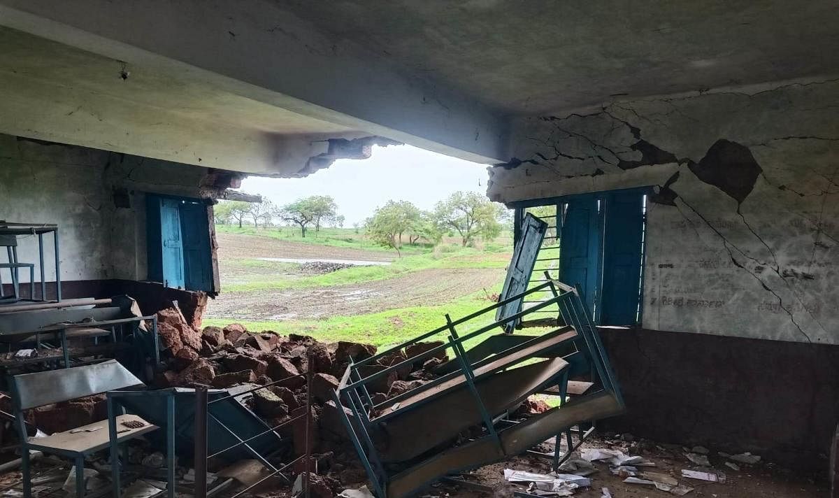 The wall of a government school collapsed at Narayanapura in Bidar district following heavy rain. Credit: DH Photo