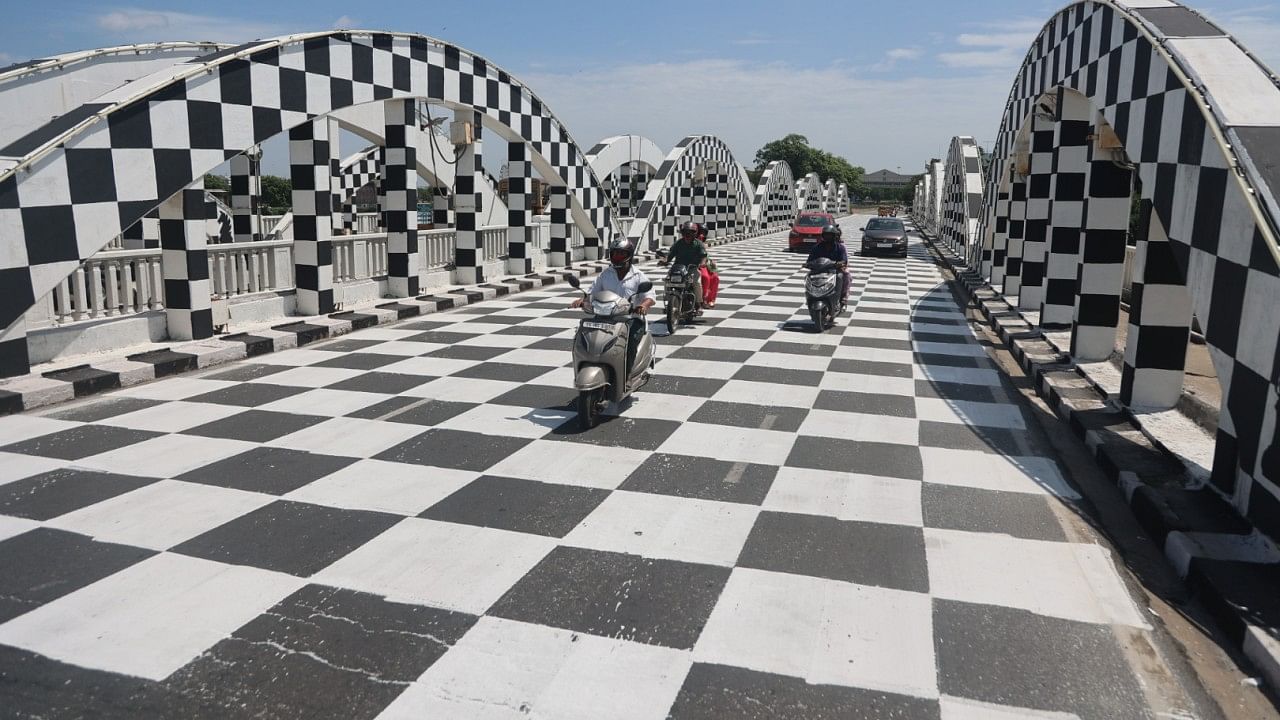 The iconic Napier Bridge next to the Marina Beach in Chennai wearing a chequered look as the city prepares itself to host the 44th Chess Olympiad. Credit: DH Photo 