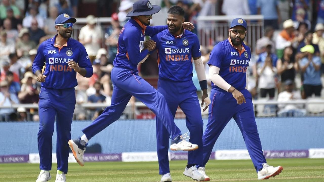India's Hardik Pandya, 2nd right, , celebrates with team mates after dismissing England's Jos Butler during the third one day international cricket match between England and India. Credit: AP Photo