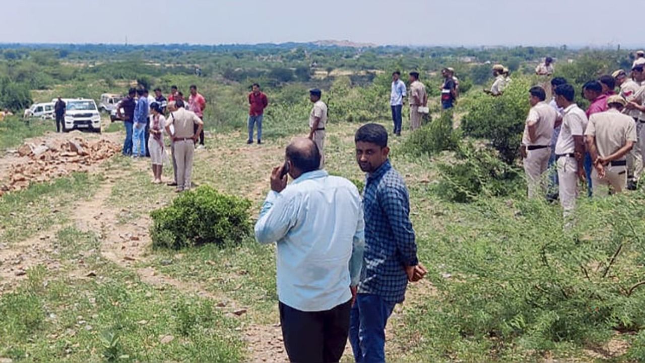 Police personnel at the crime scene after DSP Surender Singh Bishnoi was allegedly mowed down to death by the mining mafia at Pachgaon in Nuh district, Haryana, Tuesday, July 19, 2022. Credit: PTI Photo