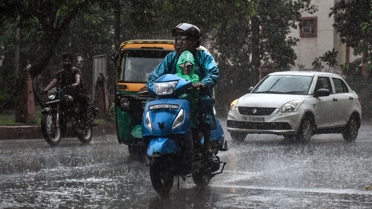 Vehicles ply on a road during monsoon rain in New Delhi, Wednesday, July 20, 2022. Credit: PTI Photo