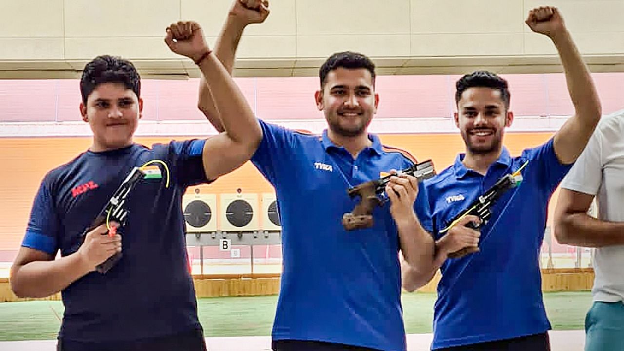 Indian sports shooters Sameer, Anish and Vijayveer Sidhu celebrate after winning the silver medal in the Men’s 25m Rapid Fire Pistol (RFP) Team event. Credit: PTI Photo