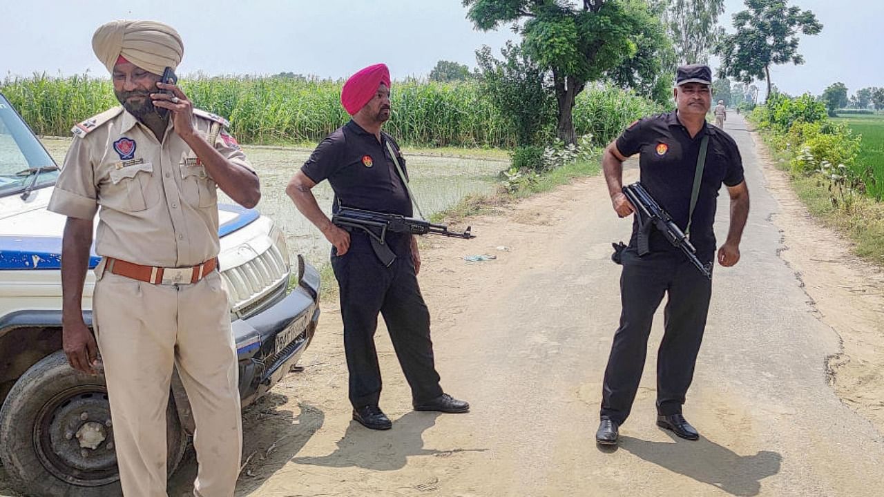 Punjab Police personnel during an encounter with gangsters who were involved in the Sidhu Moosewala murder case near Attari in Amritsar, Wednesday, July 20, 2022. Credit: PTI Photo