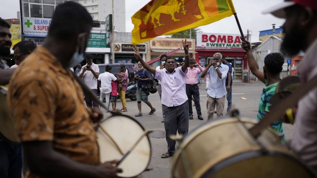 Supporters of Acting President and Prime Minister Ranil Wickremesinghe celebrate after he was elected president in Colombo, Sri Lanka, in Colombo, Sri Lanka, Wednesday, July 20, 2022. Credit: AP Photo