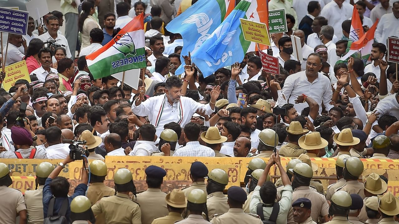 KPCC President D K Shivakumar with party workers during a protest rally in support of the party's interim President Sonia Gandhi who appeared before the Enforcement Directorate in connection with the National Herald case, in Bengaluru. Credit: PTI Photo