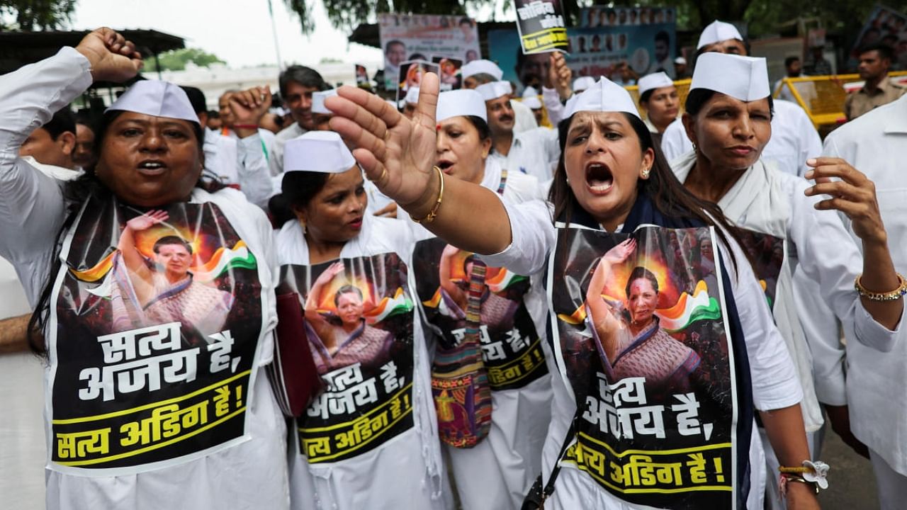 Supporters of India's main opposition Congress party shout slogans as they protest outside the party headquarters after their leader Sonia Gandhi was summoned by the Enforcement Directorate in a money laundering case, in New Delhi, India, July 21, 2022. Credit: Reuters Photo