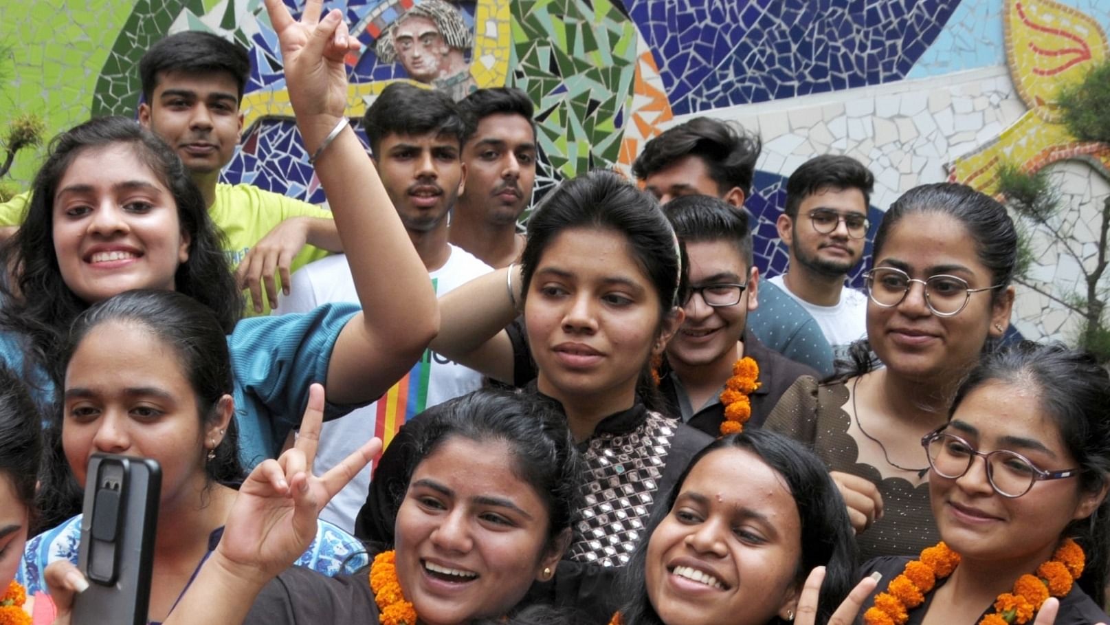 Students take a selfie as they celebrate their success after announcement of Central Board of Secondary Education (CBSE) Class 12th exam results, in Amritsar, Friday, July 22, 2022. Credit: IANS Photo