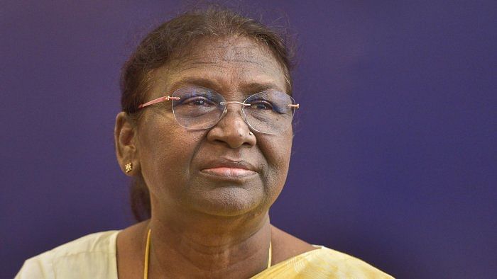 President-elect Droupadi Murmu being greeted at her residence in New Delhi. Credit: PTI Photo