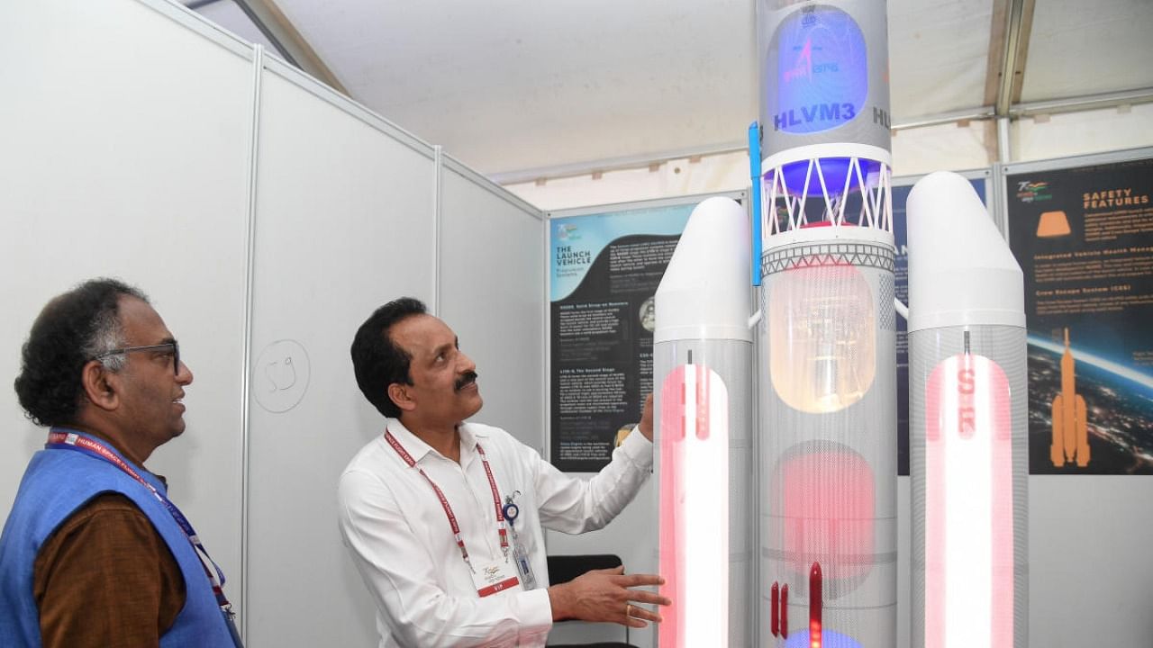Dr Umamaheswaran R, Director, Human Space Flight Centre, Isro, and Dr S Somnath, chairman, Isro, look at a model of a space shuttle displayed at the Jawaharlal Nehru Planetarium in Bengaluru. DH Photo/B H Shivakumar