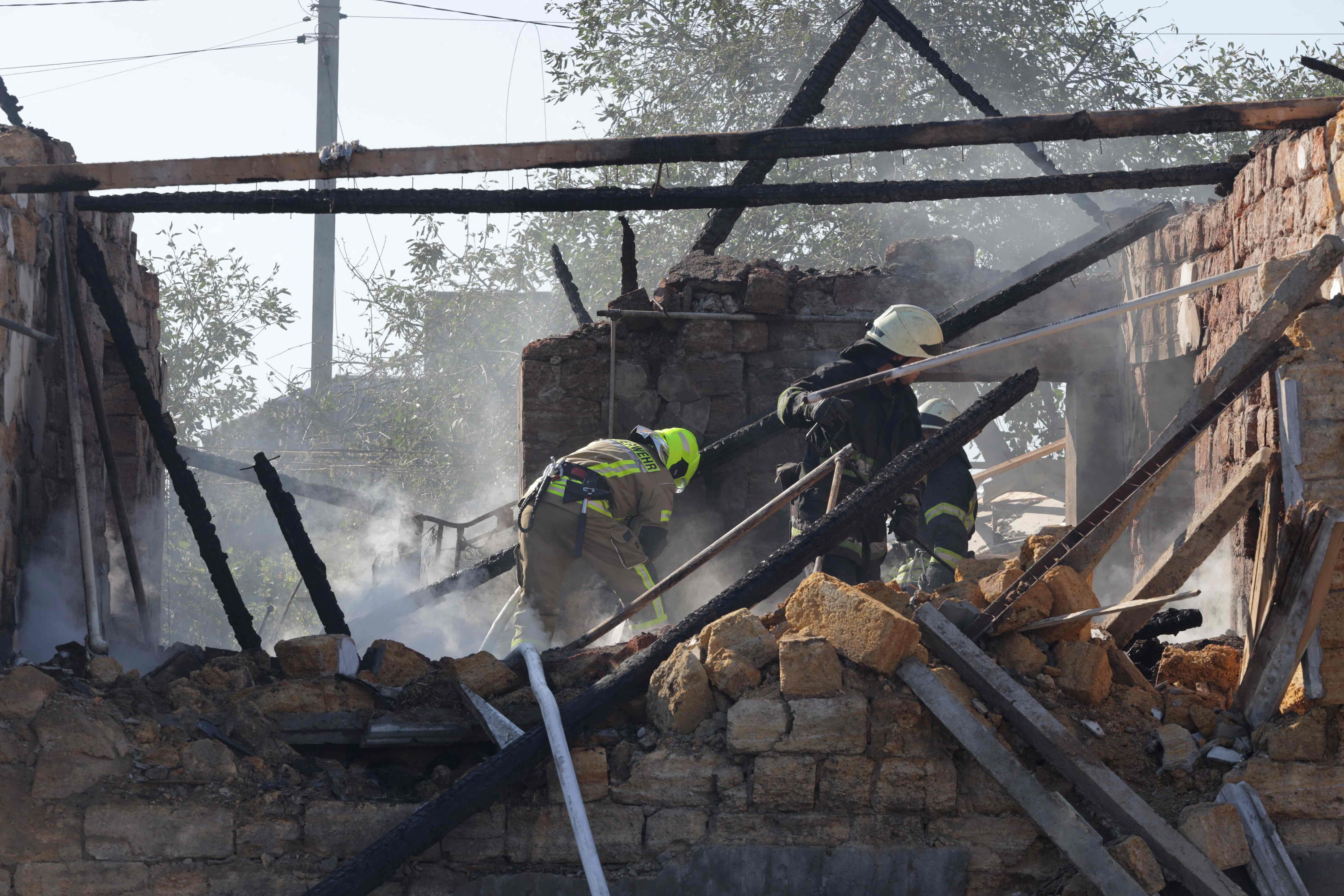 Ukrainian rescuers work outside a house destroyed following a Russian airstrike in a village in the Odessa region. Credit: AFP Photo