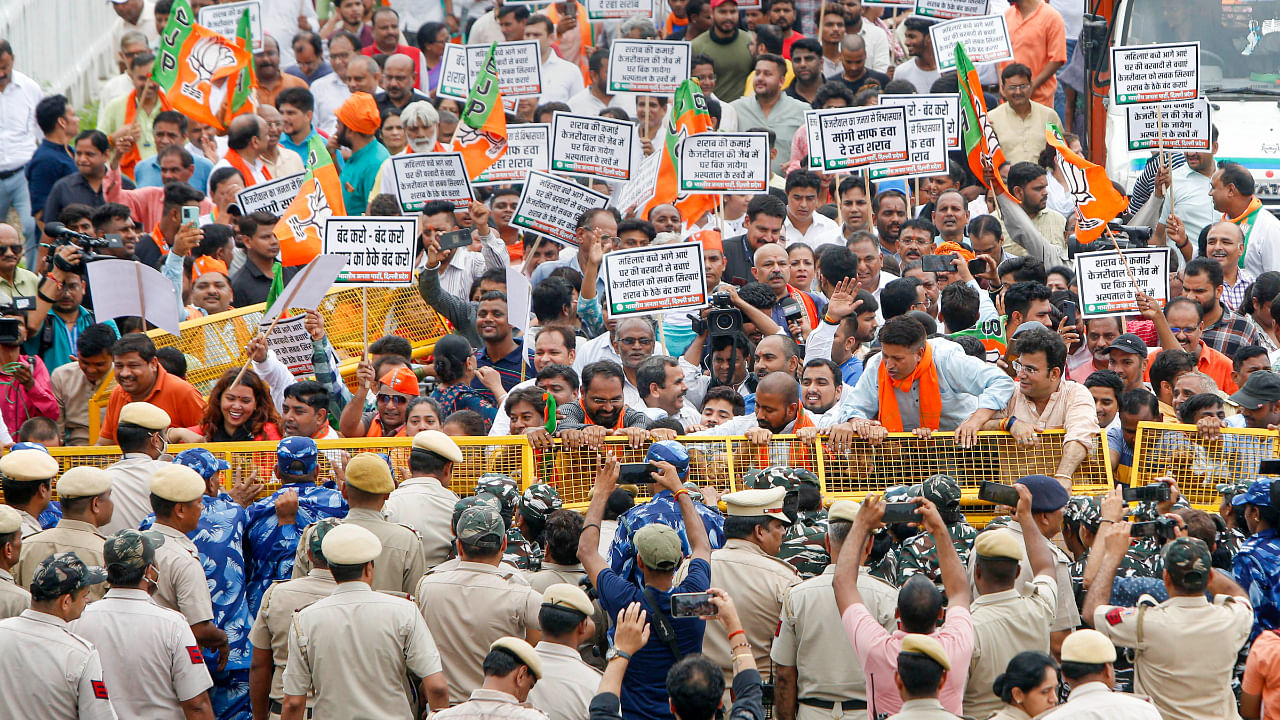 BJP activists protest against the Delhi government's Excise Policy, in New Delhi, Saturday, July 23, 2022. Credit: PTI Photo