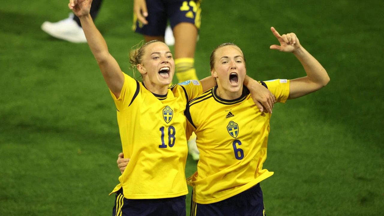 Sweden's Fridolina Rolfo and Magdalena Eriksson celebrate after the match. Credit: Reuters Photo