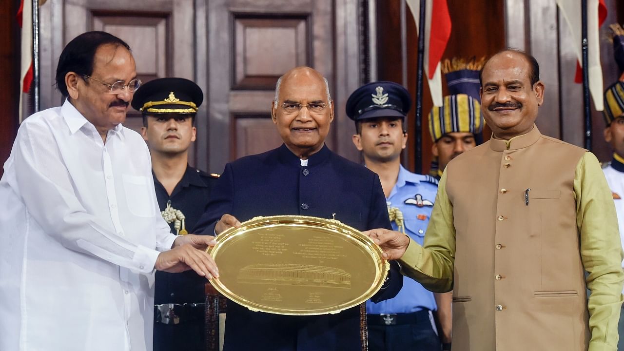 Outgoing President Ram Nath Kovind being felicitated by Vice President Venkaiah Naidu and Lok Sabha Speaker Om Birla during the farewell function at Parliament House. Credit: PTI Photo