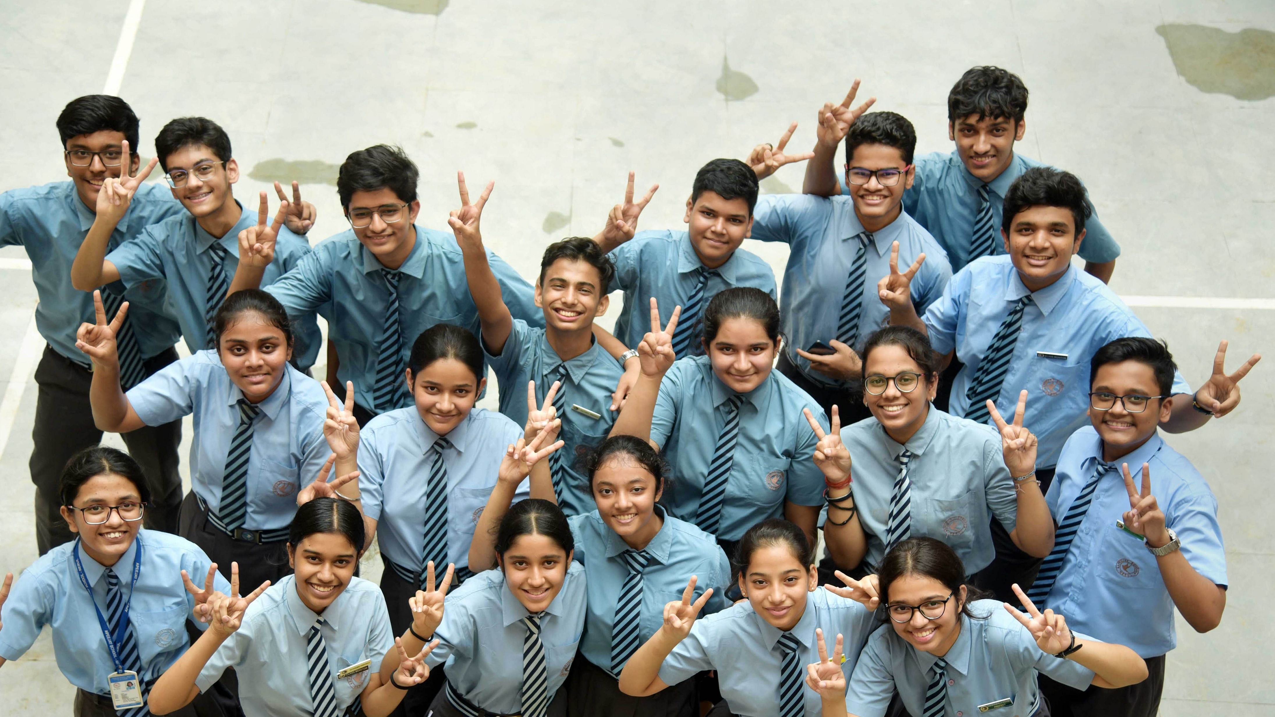  Students of Apeejay School celebrate after announcement of CBSE class 1oth results, in Bhubaneswar. Credit: PTI Photo