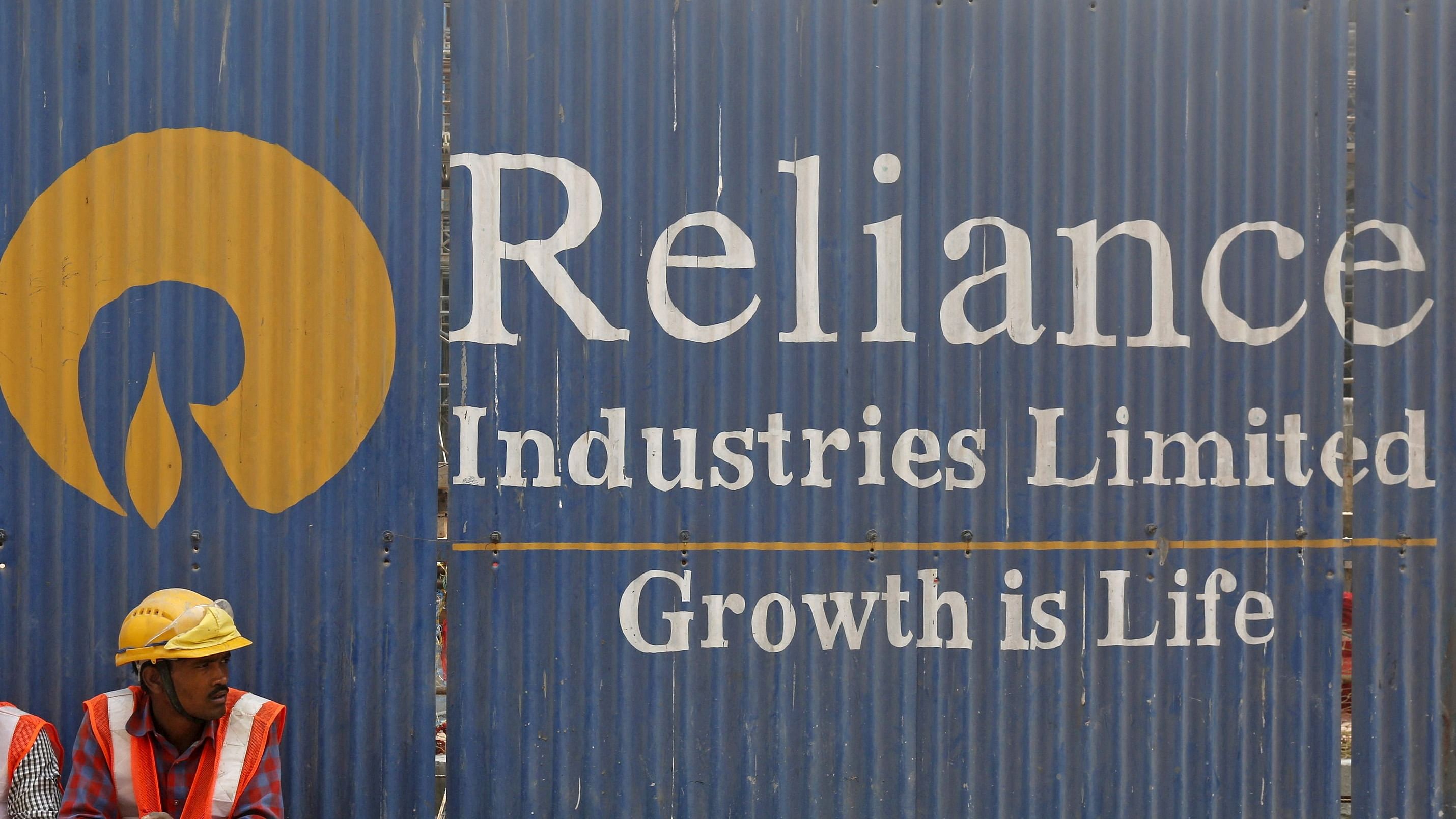 An advertisement of Reliance Industries Limited at a construction site in Mumbai. Credit: Reuter Photo