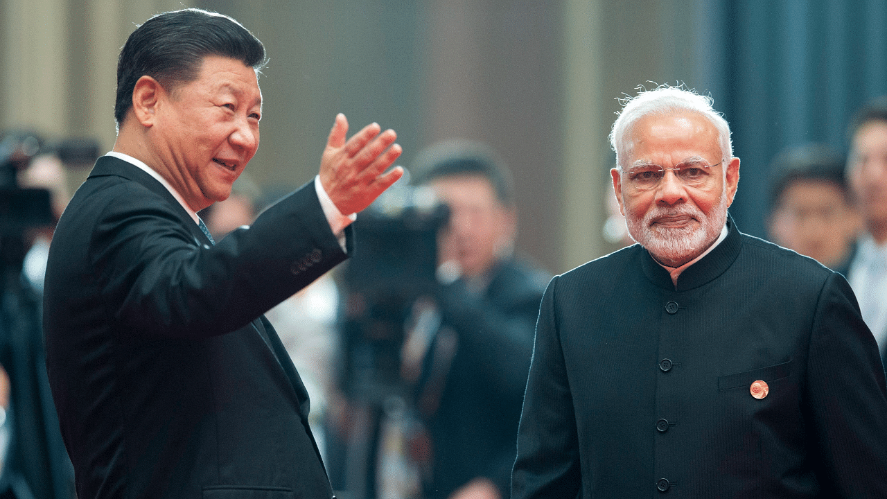 File photo of Chinese President Xi Jinping, left, and Prime Minister Narendra Modi. Credit: AP Photo