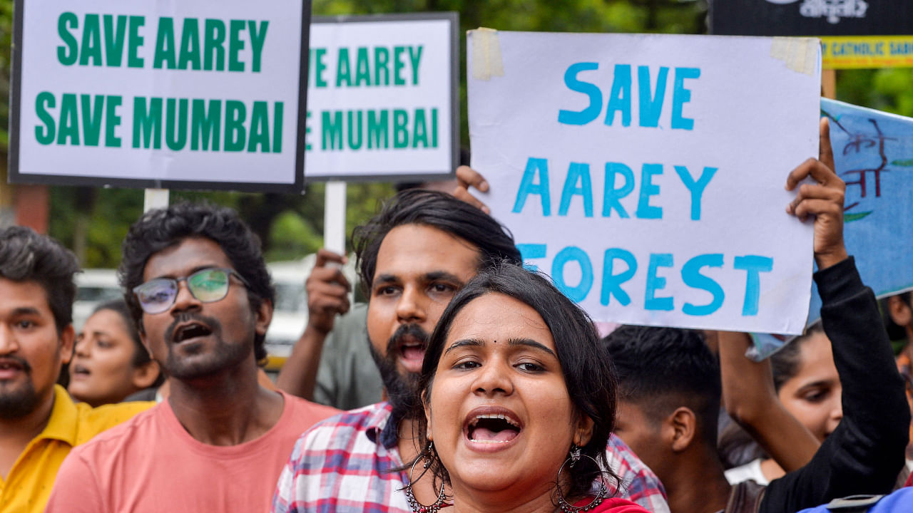 Protesters raise slogans against the construction of a a metro railway train car shed at the Aarey forest which locals call as 'Mumbai's Amazon', in Mumbai on July 24, 2022. Credit: AFP Photo