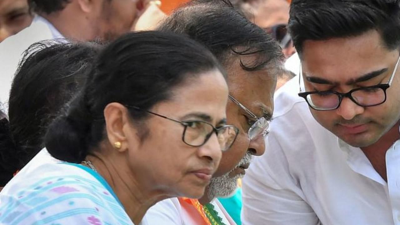 West Bengal Chief Minister Mamata Banerjee, Partha Chatterjee and MP Abhishek Banerjee. Credit: PTI Photo