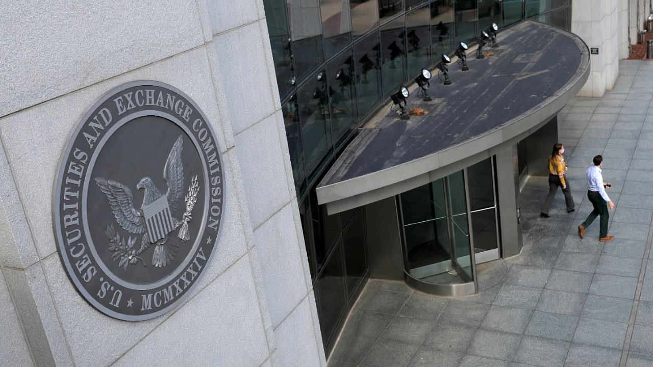 People exit the headquarters of the U.S. Securities and Exchange Commission (SEC) in Washington, D.C., U.S., May 12, 2021. Credit: Reuters File Photo