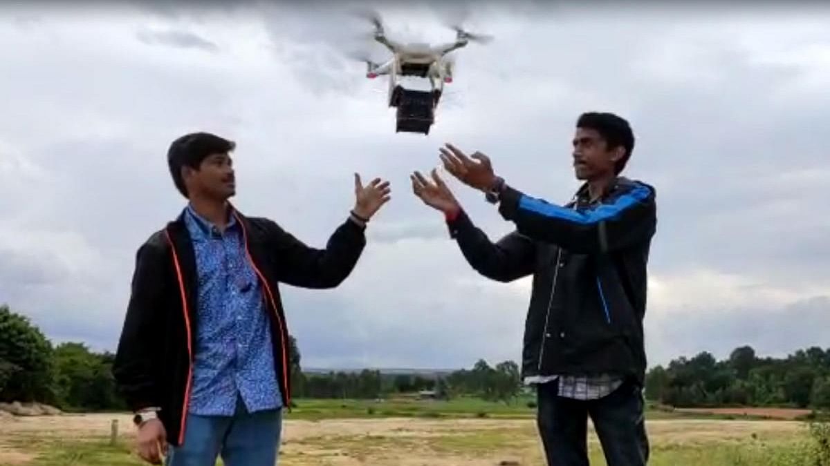 Lakshya Space team members demonstrate the drone-based launch of a cubesat (mini satellite) from a farm in Yelahanka in Bengaluru. Credit: Special arrangement