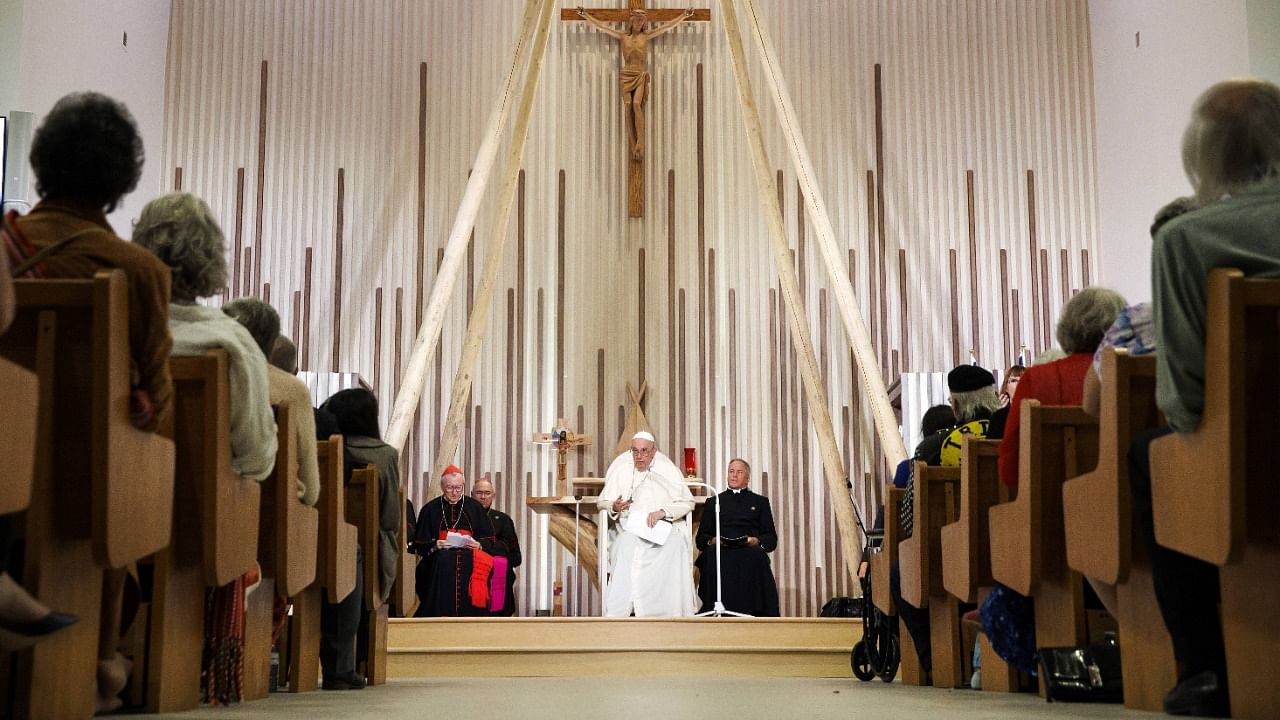 Pope Francis gives a blessing at the Sacred Heart Catholic Church of the First Peoples on July 25, 2022 in Edmonton, Canada. Credit: AFP Photo