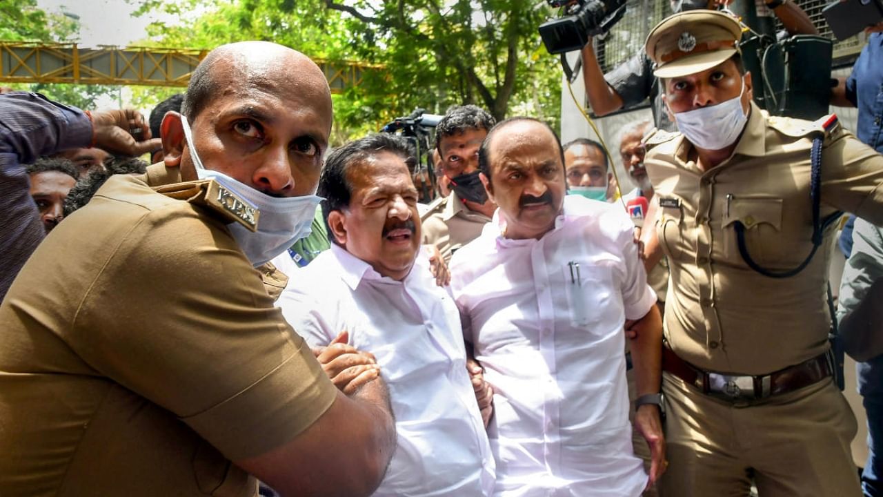 Police detain senior Congress leader Ramesh Chennithala (L) and Opposition leader VD Satheesan during a protest against ED's questioning of party Chief Sonia Gandhi in the National Herald case, in Thiruvananthapuram, Wednesday, July 27, 2022. Credit: PTI Photo