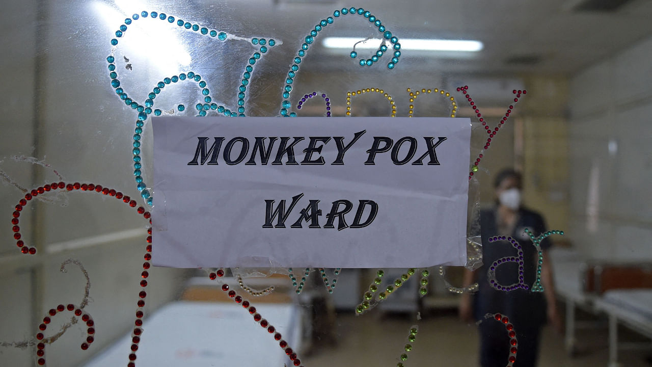 A health worker walks inside an isolation ward built as a precautionary measure for the monkeypox patients at a civil hospital in Ahmedabad on July 25, 2022. Credit: AFP Photo