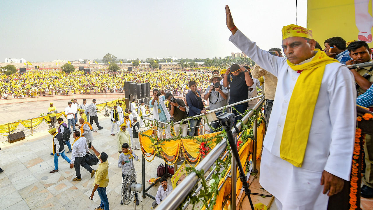 SBSP president Om Prakash Rajbhar waves at supporters during a rally to mark the 16th foundation day of the party in Lucknow, Oct 27, 2018. Credit: PTI File Photo