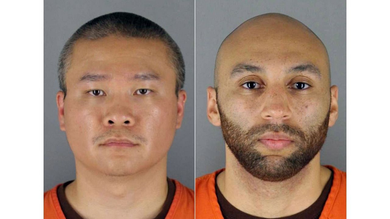 This combination of handout photos provided by the Hennepin County Jail created on June 03, 2020 shows (L-R) ex-officers Tou Thao, J. Alexander Kueng in booking photos. Credit: AFP Photo/Hennepin County Jail