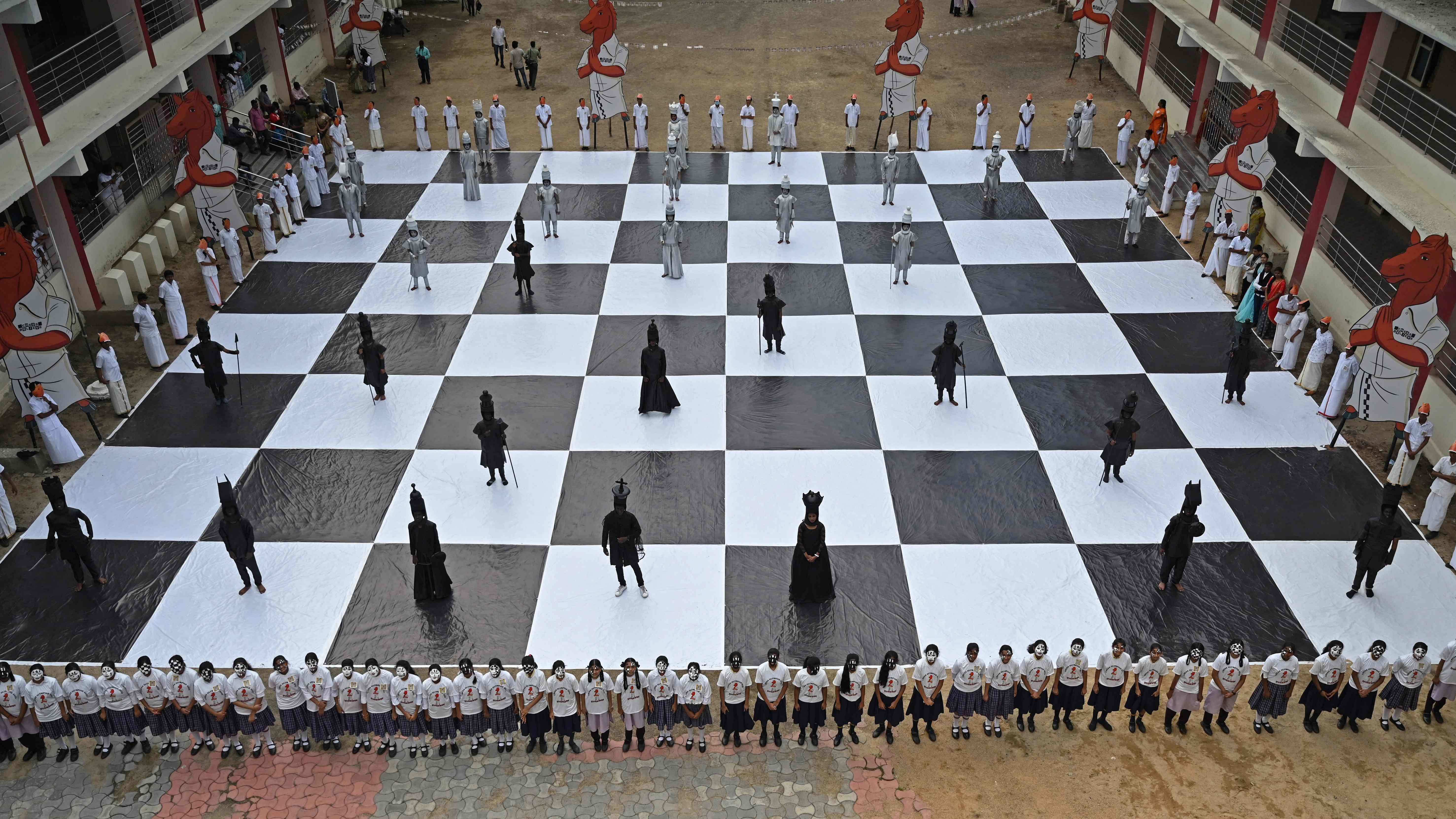 Children dressed as chess pieces perform during an event organised ahead of the Chess Olympiad. Credit: AFP Photo