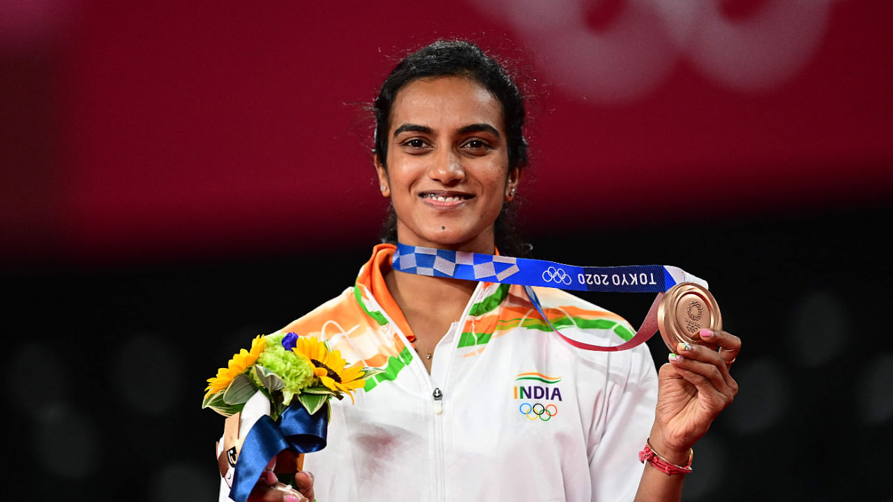 P V Sindhu poses with her women's singles badminton bronze medal at a ceremony during the Tokyo 2020 Olympic Games, August 1, 2021. Credit: AFP File Photo