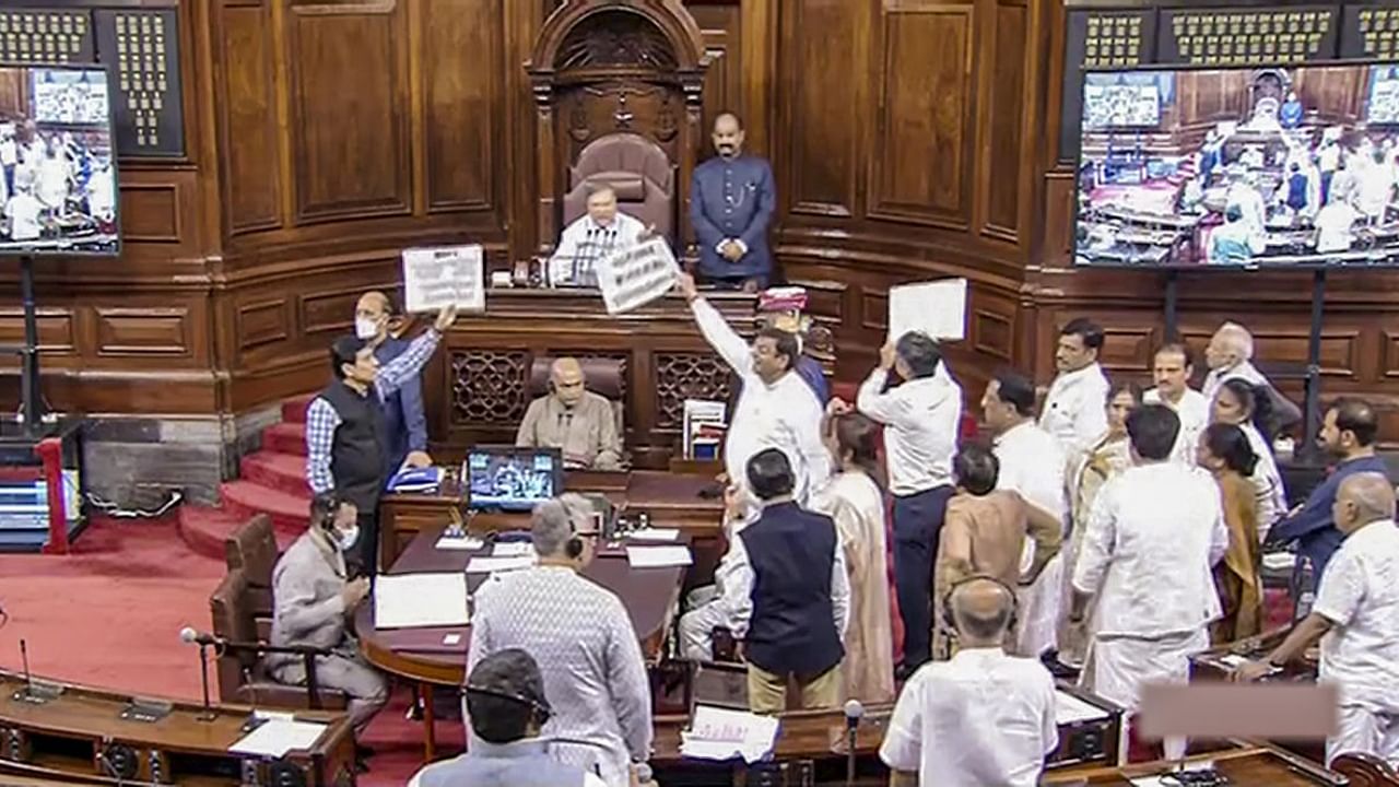 Members protest in well of the Rajya Sabha during ongoing Monsoon Session of Parliament, in New Delhi, Thursday, July 28, 2022. Credit: PTI Photo