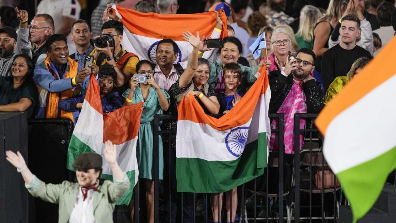 Indian team's supporters watch the Commonwealth Games opening ceremony. Credit: AP Photo