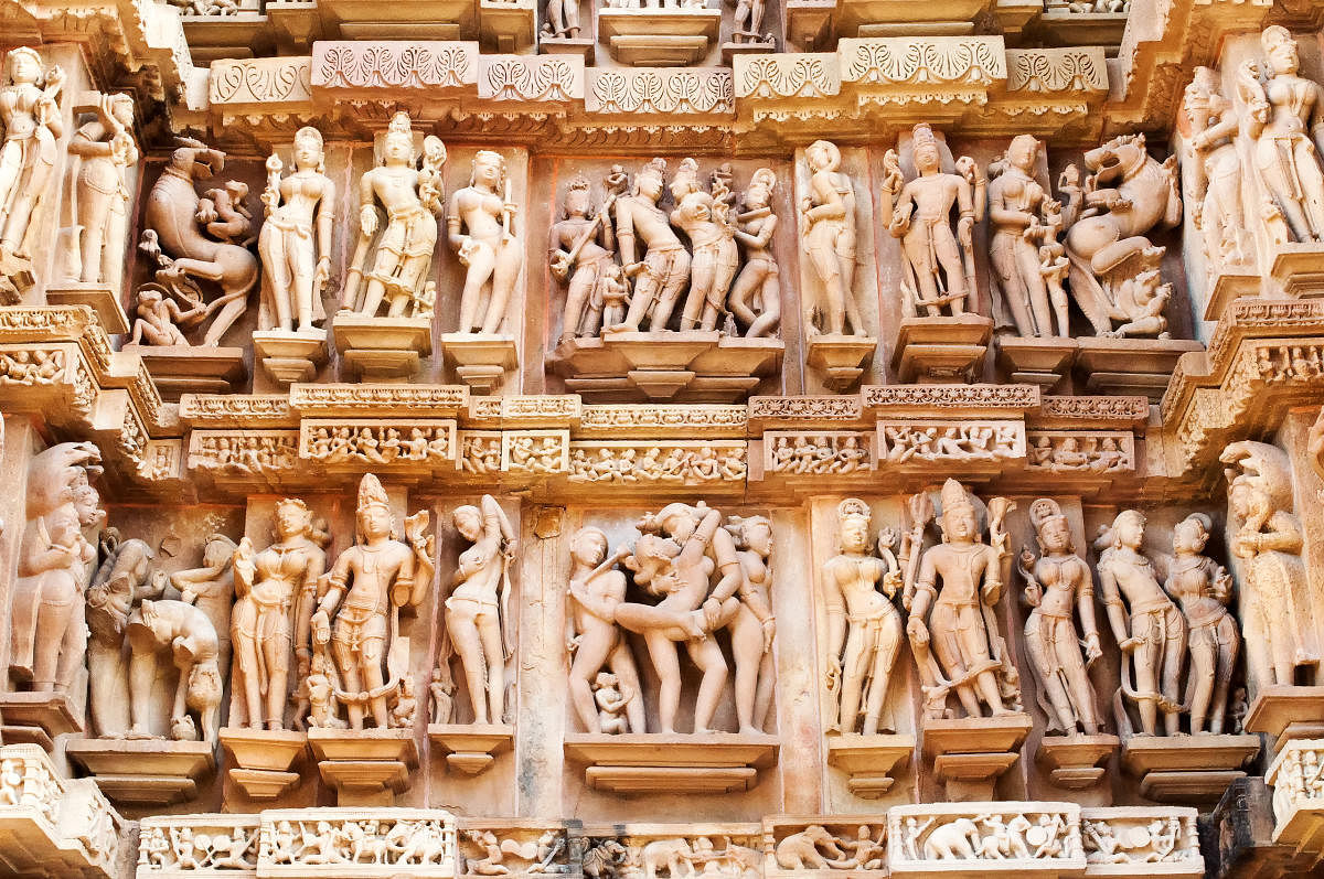 Erotic Human Sculptures at Vishvanatha Temple, Western temples of Khajuraho, Madhya Pradesh, India. Built around 1050, Khajuraho is UNESCO World heritage site. Credit: Getty Images