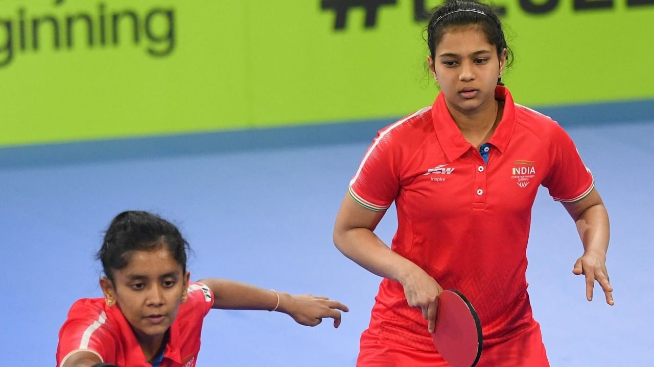 Indian (red) women table tennis players D.Chaitale and S.Akula. Credit: IANS Photo