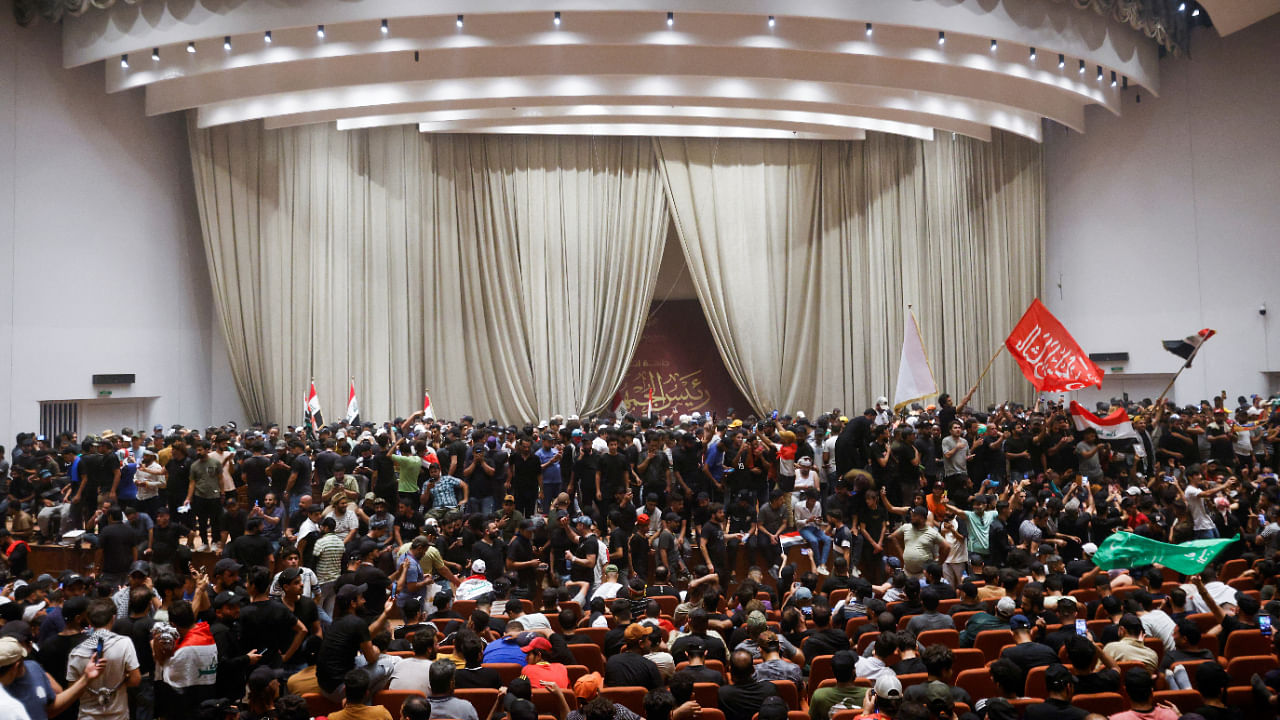 Supporters of Iraqi Shi'ite cleric Moqtada al-Sadr protest against corruption inside the Parliament, in Baghdad, Iraq July 30, 2022. Credit: Reuters Photo