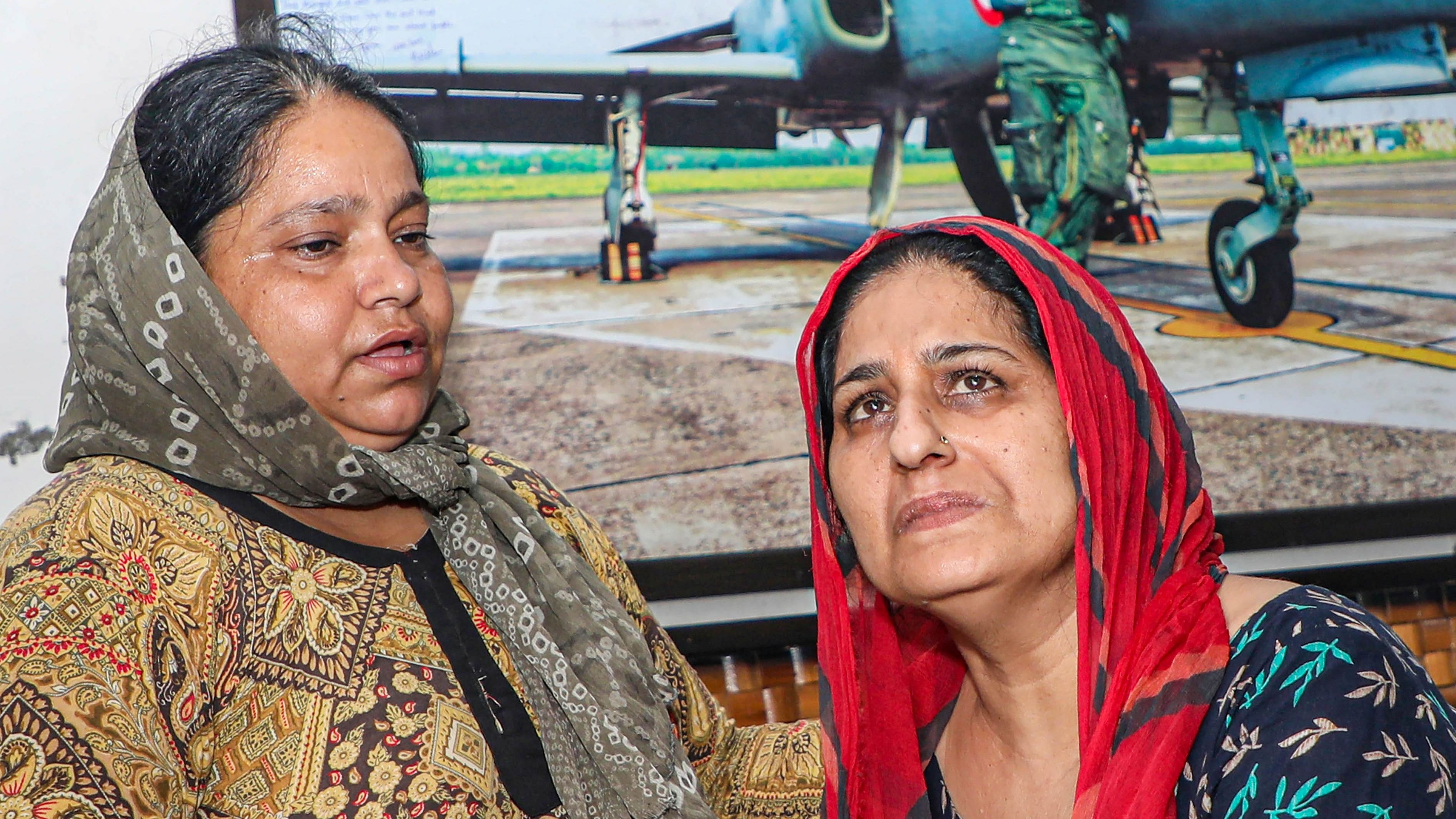 Family members of Flight Lieutenant Advitiya Bal react as they wait for his mortal remains, at his residence in Jammu. Credit: PTI Photo