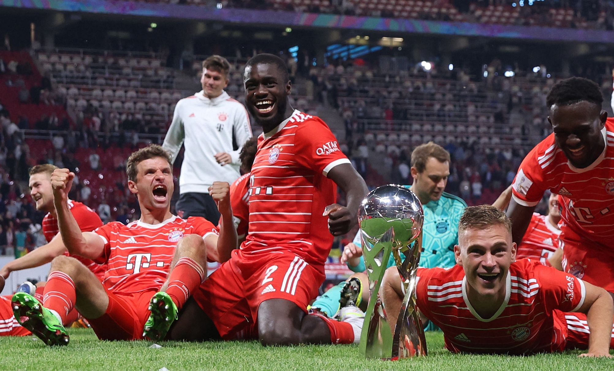 Bayern players pose with the trophy after winning the German Supercup football match between RB Leipzig and FC Bayern Munich in Leipzig. Credit: AFP Photo