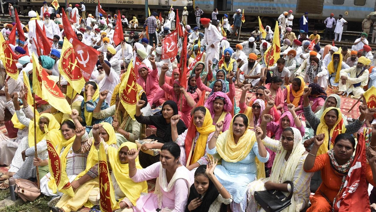 Farmers alleged that they were forced to squat on rail tracks as the Centre was "not listening to their demands". Credit: AFP Photo