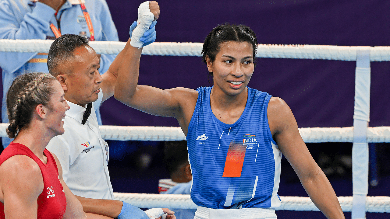  Lovlina Borgohain (Blue) after her win against Ariane Nicholson (Red) of New Zealand during the women's 66-70kg (light middleweight) boxing match of the Commonwealth Games. Credit: PTI Photo