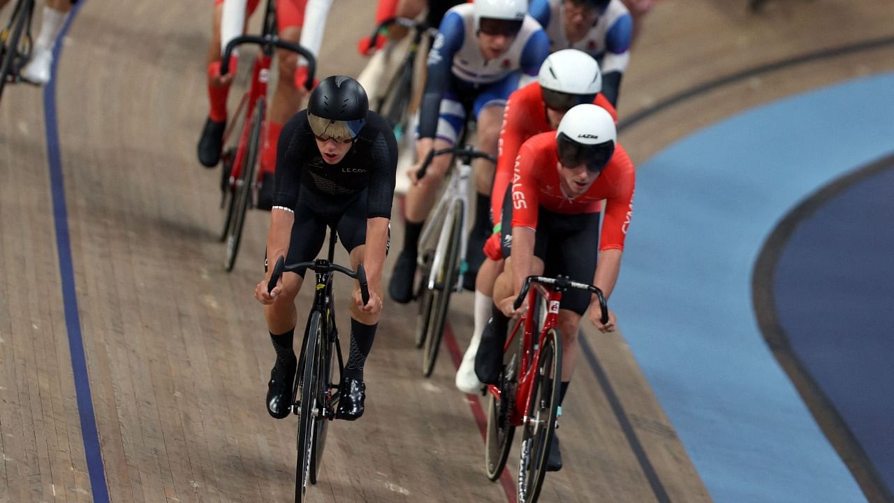 New Zealand's Corbin Strong (FRONT L) competes in the men's 15km scratch race final cycling event on day three of the Commonwealth Games, at the Lee Valley VeloPark in east London. Credit: AFP Photo