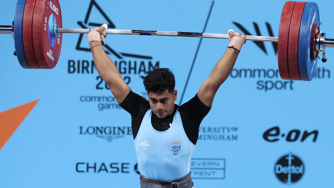 Weightlifter Achinta Sheuli (73kg) lived up to his top billing as he clinched India's third gold. Credit: Reuters Photo