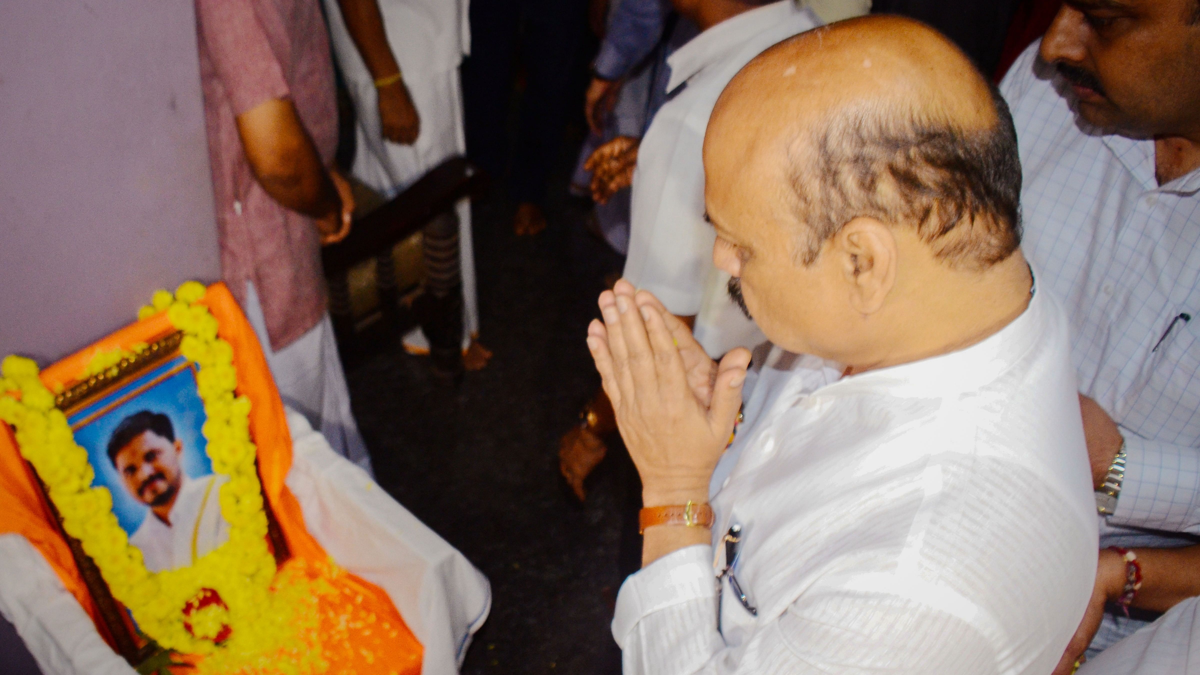 Karnataka Chief Minister Basavaraj Somappa Bommai pays tribute to BJP worker Praveen Nettaru, who was murdered by unidentified people. Credit: PTI Photo 