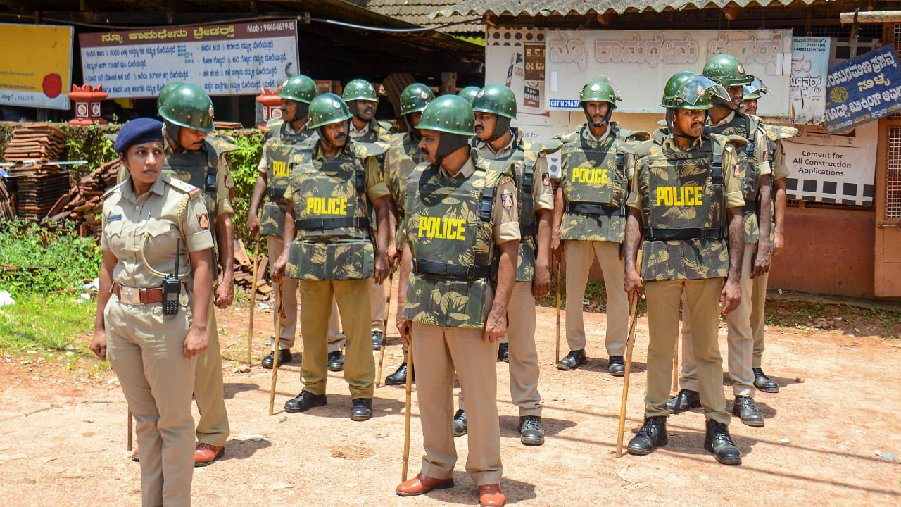 Police personnel stand guard in Puttur, Thursday, July 28, 2022. Credit: PTI Photo