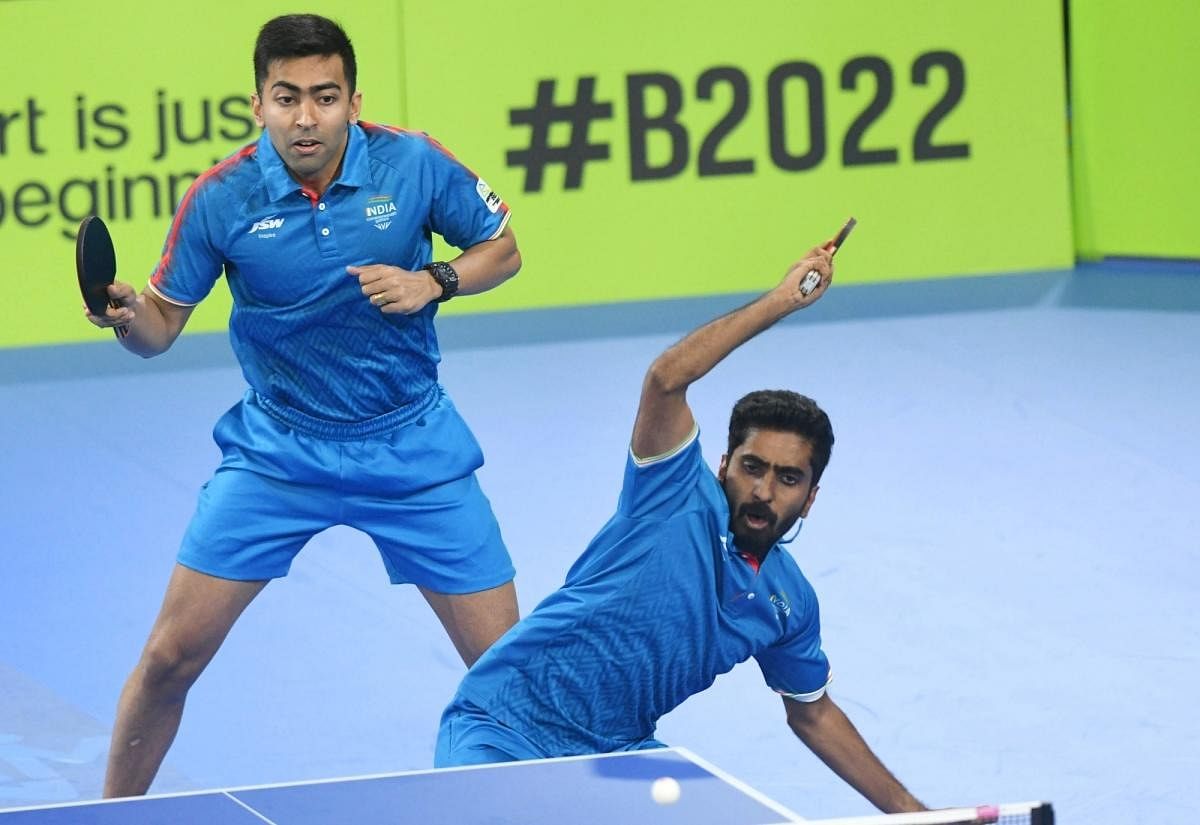 Harmeet Desai and Sathiyan Gnanasekaran in action during the final of the table tennis at the Commonwealth Games. Credit: IANS Photo