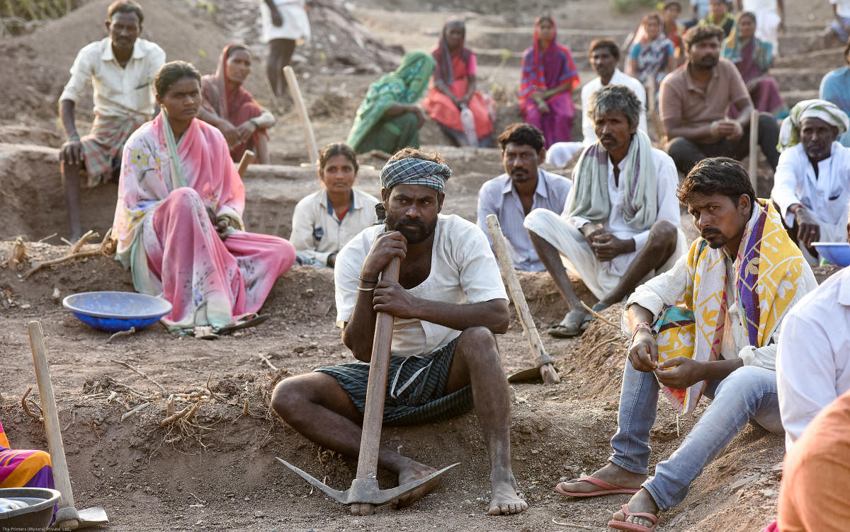 Coolie workers wait for President, Drought Study Cabinet Sub Committee Bandeppa Kashanpur, District Incharge Minister Priyank Kharge in Kudachi village in yadrami taluk in Kalaburagi District on Friday. Credit: DH Photo