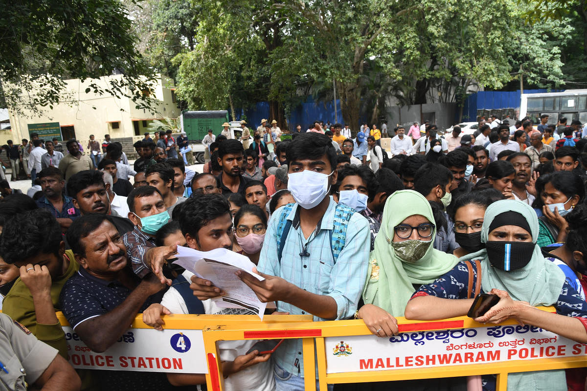 The KCE repeat candidates stage a protest in front of Karnataka Examinations Authority (KEA), demanding that their second-year PU scores be considered for the rankings, in Bengaluru on Monday. Credit: DH Photo/ B H Shivakumar