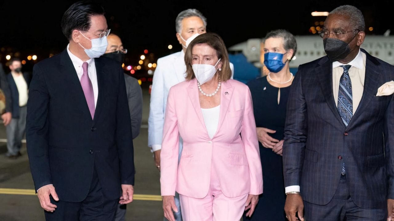 Taiwan Foreign Minister Joseph Wu welcomes US House of Representatives Speaker Nancy Pelosi at Taipei Songshan Airport in Taipei, Taiwan August 2, 2022. Credit: Reuters Photo